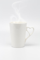 A white creamy cup with steam and heart symbol handle