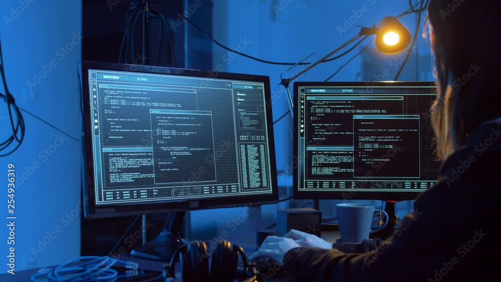 Poster cybercrime, hacking and technology concept - female hacker in dark room creating code or using compu