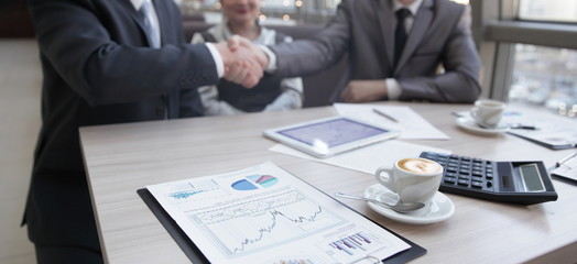 close up.handshake financial partners at the table of negotiations