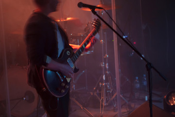 Guitarist plays solo on electric guitar