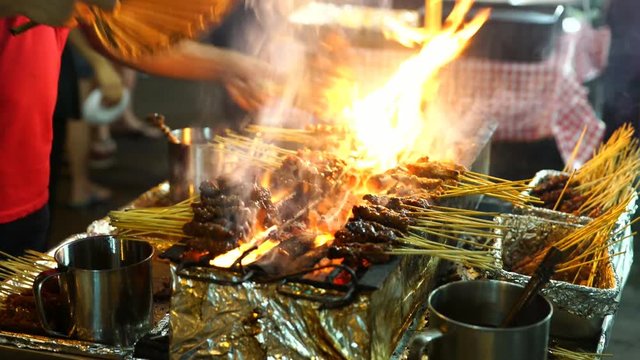 Meat Skewers Cook Over Hot Coals In Singapore's Satay Street Food Market, Lockdown.