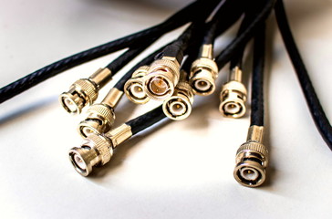 BNC jack with black coaxial cable for video and audio signal or CCTV system on white background