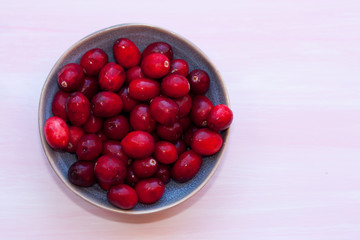 Raw cranberries in a bowl.