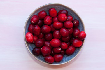 Raw cranberries in a bowl.