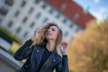 Fototapeta premium young sexy russian hard rock biker girl in the city of eden