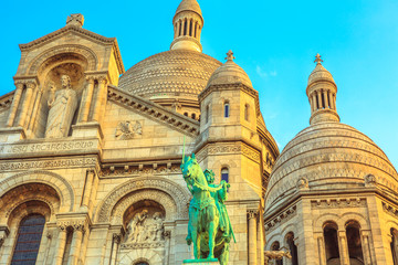 Fototapeta na wymiar Detail of facade of Sacred Heart of Paris church in France. Basilique du Sacre-Coeur de Montmartre, the historic district of Paris Capital. Sunset light.