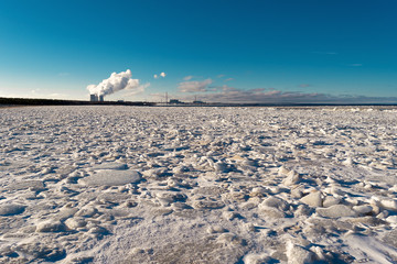 cooling towers emit steam at a nuclear power plant located on the shore of the Bay.Cooling of...