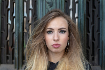 Fototapeta na wymiar young sexy russian hard rock biker girl in the city of eden