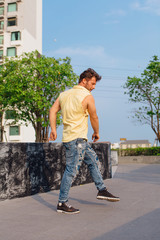 Young man dancing breakdance on the street.