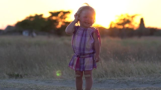 Joyful child. A delighted child enjoys nature. Children's laughter.