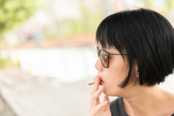 modern Asian beauty smoking