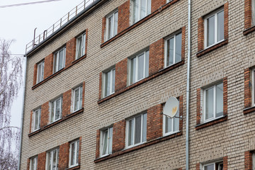 Fototapeta na wymiar facade of a old russian Khrushchev- era brick house