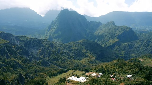 Aerial view over the dramatic volcanic mountain landscape surrounding the town of Hell-Bourg on Reunion Island