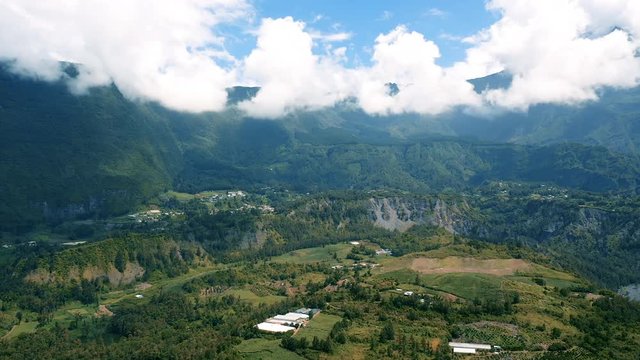 Aerial view over the dramatic mountain landscape surrounding the town of Hell-Bourg on Reunion Island