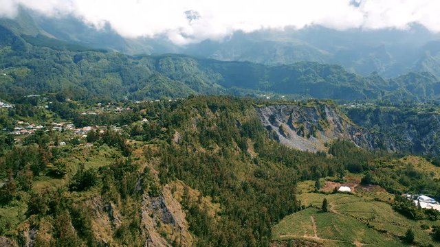 Aerial view over the dramatic mountain landscape surrounding the town of Hell-Bourg on Reunion Island