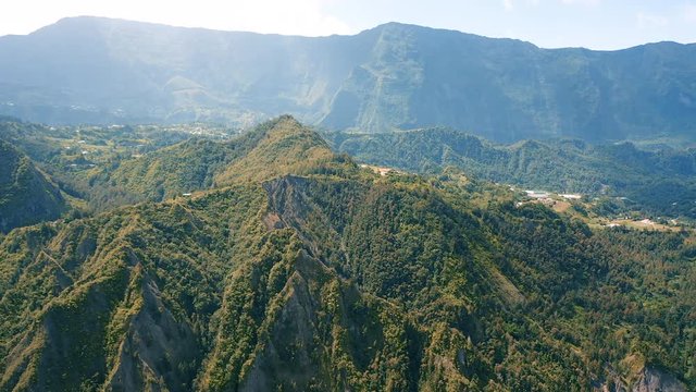 Aerial view over the dramatic mountain landscape surrounding the town of Hell-Bourg on Reunion Island