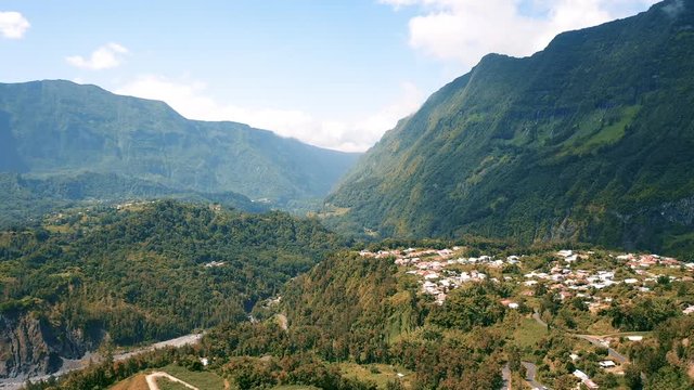 Aerial view over the town of Hell-Bourg on Reunion Island. Surrounded by large mountains