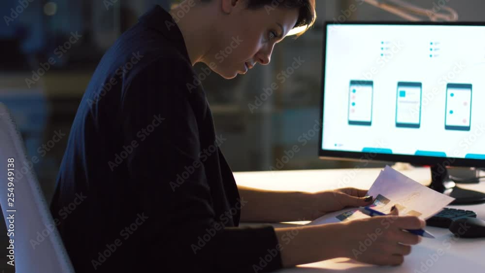 Wall mural business, technology and people concept - ui designer with smartphone templates on computer screen w