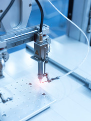 soldering iron tips of robotic system for automatic point soldering for printed and assembly electric circuit board ( PCB ) at factory