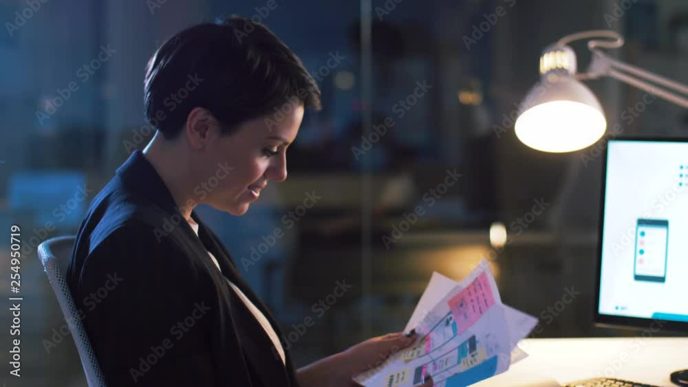 Wall mural business, technology and people concept - ui designer with smartphone templates on computer screen w