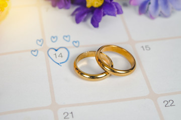 Word Wedding to Reminder Wedding day with Wedding ring on calendar planning and office tool.