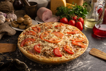 Pizza with ham and mushrooms for a restaurant menu.