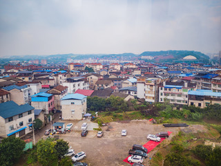 Fototapeta na wymiar Beautiful zhangjiajie Cityscape view from cable car to tianmen mountain in the morning.Downtown Urban building scene of zhangjiajie city hunan china