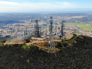 Aerial view of telecommunication antennas on the top of Black Mountain in Carmel Valley, SD, California, USA.  Television, radio and communications antenna with numerous transmitters, Technology.