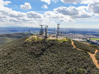 Aerial view of telecommunication antennas on the top of Black Mountain in Carmel Valley, SD, California, USA.  Television, radio and communications antenna with numerous transmitters, Technology.