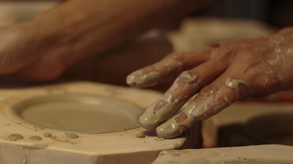 Fototapeta na wymiar Hands of potter making