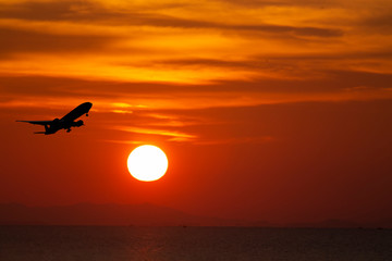 airplane taking off airport sky-diving industry cargo business, concept: passenger Commercial  modern navigable Travel and business,Silhouette aircraft is flying above skyline sun