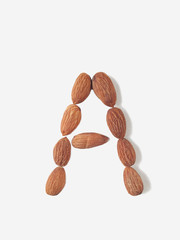 Isolated alphabet letter A made by almonds