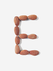 Isolated alphabet letter E made by almonds