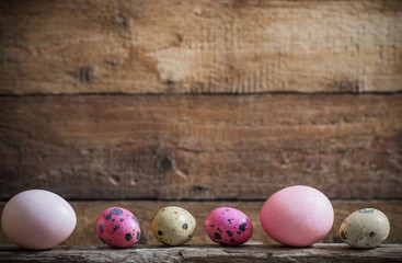 Easter eggs on old wooden background