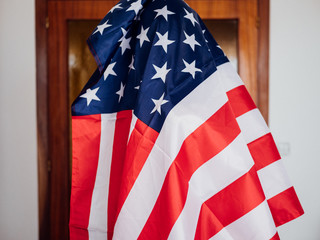 Man covering himself with the United States flag