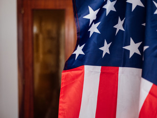 Man covering himself with the United States flag