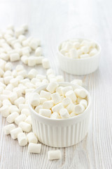 Fototapeta na wymiar White marshmallows in a bowl.