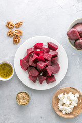 Ingredients ready for preparing beetroot salad with goat cheese and walnuts. top view