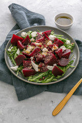 Beetroot salad with feta cheese, argula and walnuts