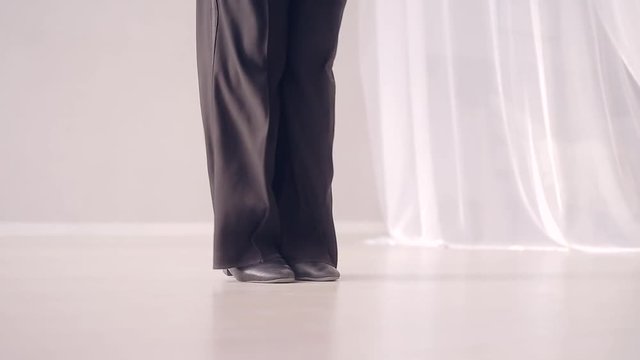 Close - up of dancing legs.