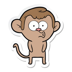 sticker of a cartoon hooting monkey