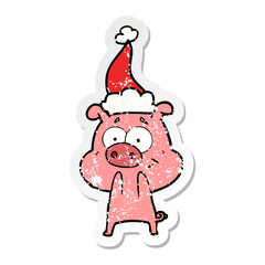 happy distressed sticker cartoon of a pig wearing santa hat