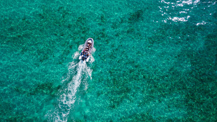 aerial view of a boat moving with the people on board
