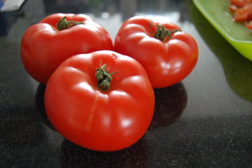 fresh tomatoes on granite counter