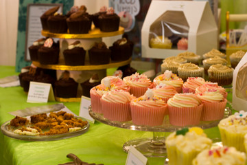 fresh cupcakes and cakes on street food market