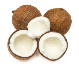 Coconuts whole, half and piece isolated on white background. Tropical fruit. Flat lay, top view