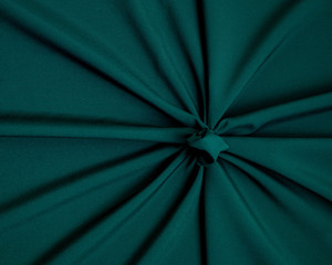 Pleated fabric material texture background closeup top view