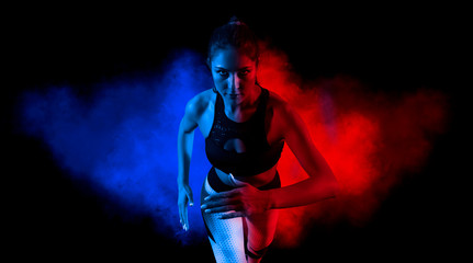 Obraz premium Woman sprinter leaving starting