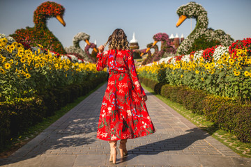 woman in red dress on the sun of dubai