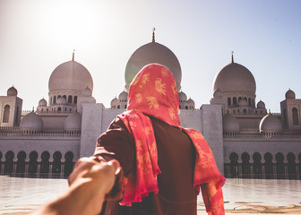 woman in red dress on the sun of dubai